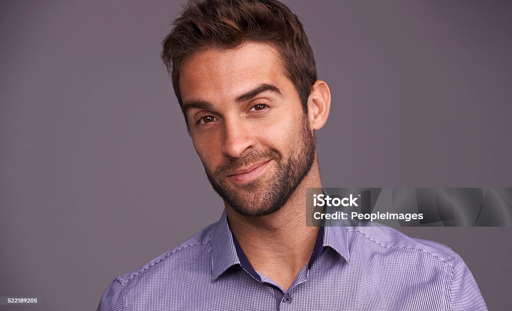 It's all good Studio shot of a handsome young man posing against a gray background 30-39 Years Stock Photo