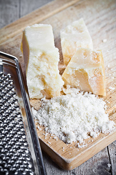istock grated parmesan cheese and metal grater 522198943