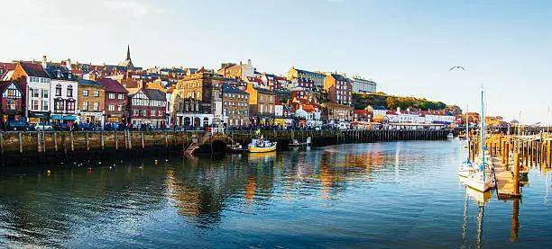Scenic view of Whitby city in autumn sunny day.Whitby's attraction as a tourist destination is enhanced by its association with the world famous horror novel Dracula, written by Bram Stoker