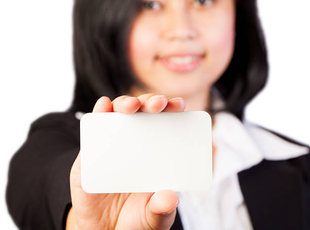 istock Woman holding blank white business card 522203629