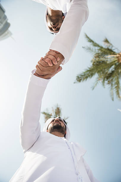 istock sheikh doing a deal in UAE 522204887