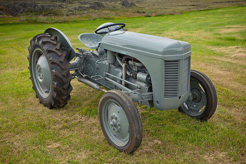 Retro Tractor on the Iceland field. Horizontal image