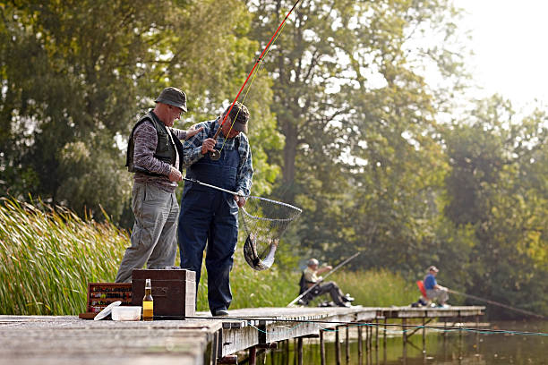 istock Two fisherman on dock fishing 522220719