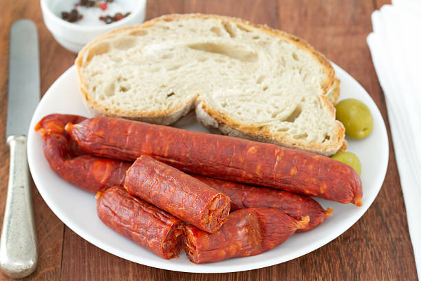 istock sausages with bread on the white plate 522221327