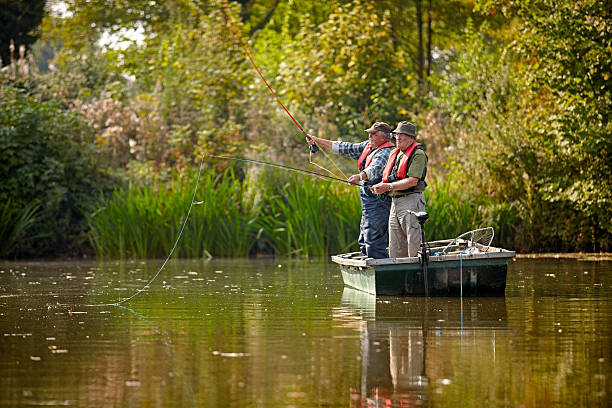 istock Two senior men fishing on a lake 522222329