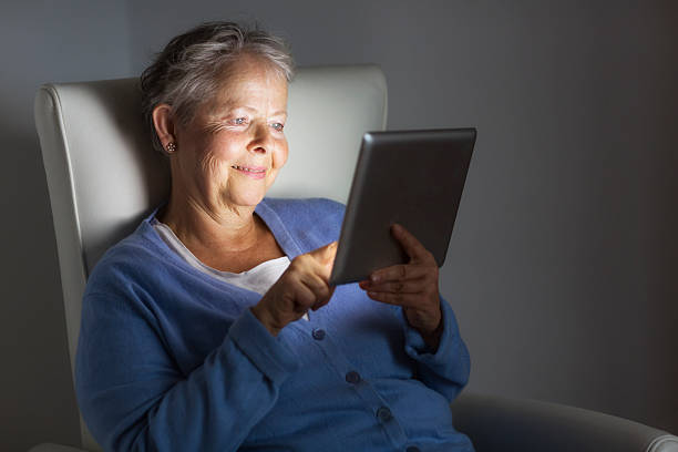 istock senior adult relaxing with digital tablet 522222399