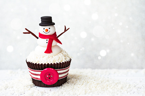 Snowman cupcake with copyspace to side