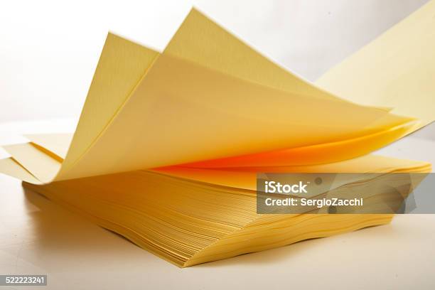 Sheets Of Printer Paper Falling On White Background Stock Photo