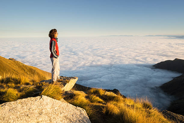 istock Woman resting on the mountain top 522224267
