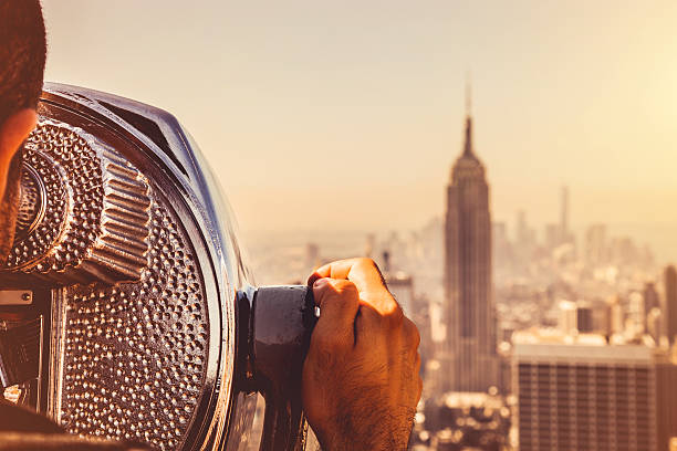 Looking at New York skyline Looking at New York skyline, close up of an old binocular for tourists. empire state building photos stock pictures, royalty-free photos & images