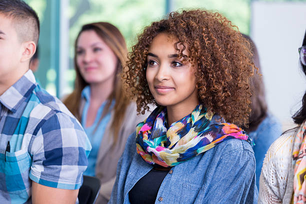 istock Diverse college students listening to lecturer during conference 522225877