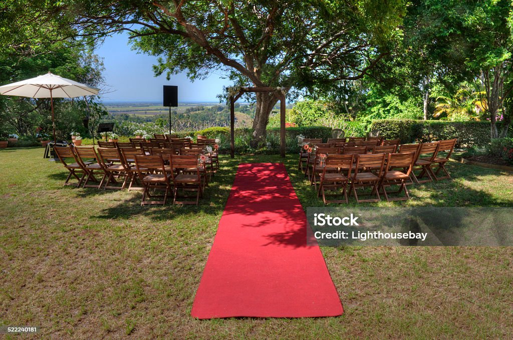 Wedding venue Shot of a civil wedding ceremony set-up outside Chair Stock Photo