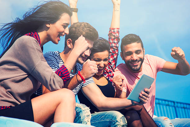 istock Friends watching sport on digital tablet 522241219