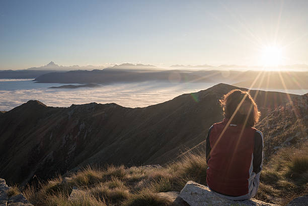istock Woman resting on the mountain top 522241843