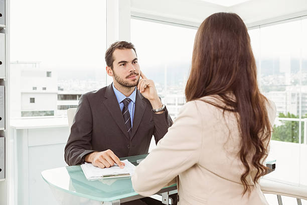 istock Businessman interviewing woman in office 522242591