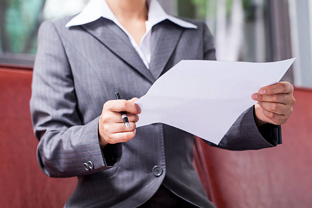 istock Businesswoman Holding a Paper 522242937