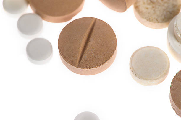 istock Stack of different pills in blisters isolated on white backgroun 522243421