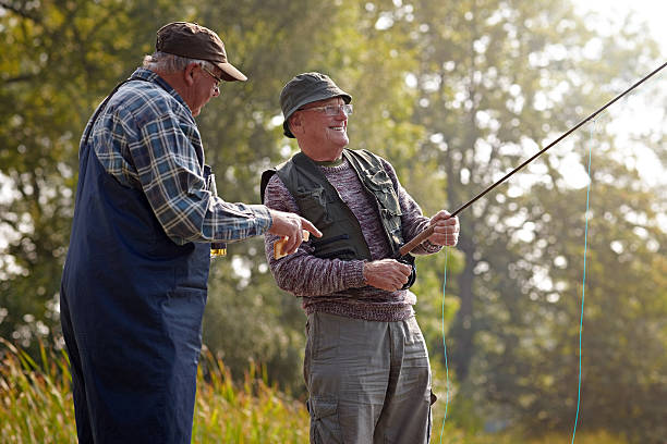 istock Two senior adults fishing on lake 522243785