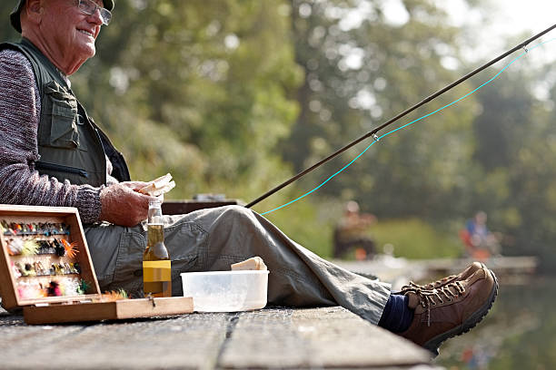 istock Fisherman having lunch on fishing dock 522244217