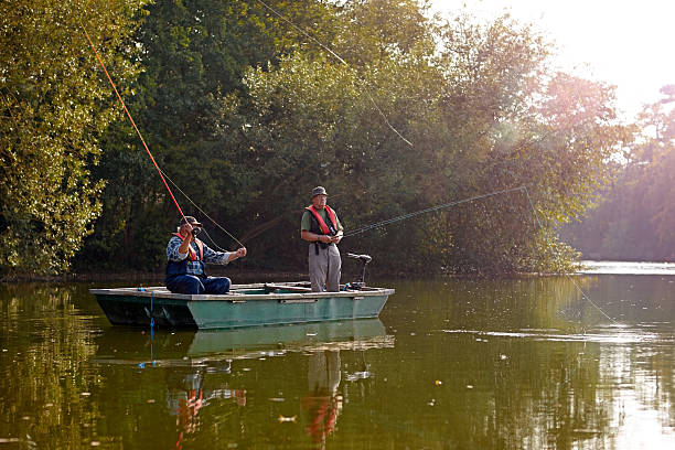 istock Two seniors fishing on a lake 522245253