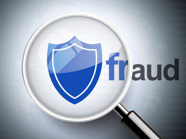 istock magnifying glass with shield icon and fraud word 522247663