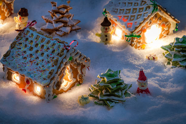 istock Small gingerbread houses in the snow 522247755