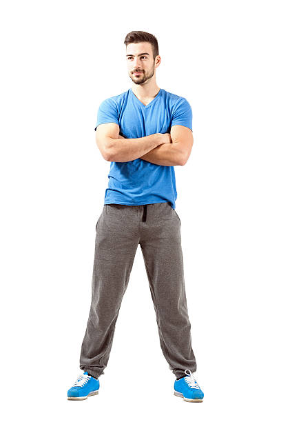 istock Confident young fit male with folded hands looking away. 522256553