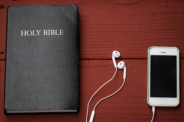 istock Contemporary image of a Bible and mobile phone 522257511
