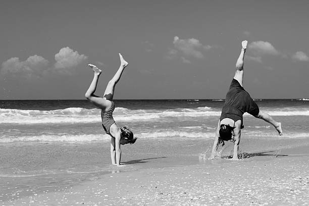 Mother and daughter Mother and daughter on the beach black and white beach stock pictures, royalty-free photos & images