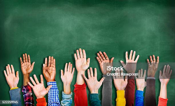 Group Of Multiethnic Diverse Hands Raised Stock Photo - Download Image Now - Hand Raised, Classroom, Lecture Hall