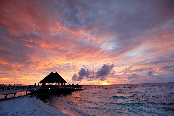 istock Beach and tropical houses on sunset 522259995