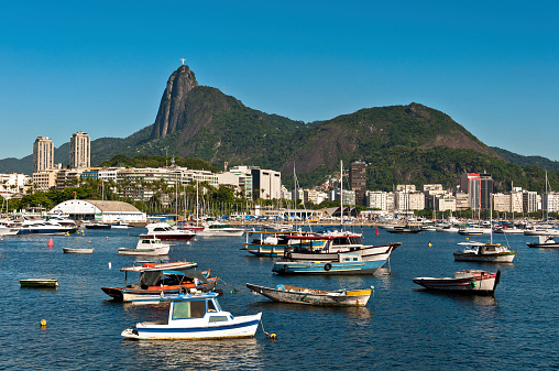 Scenic View of Rio de Janeiro City and Corcovado Mountain with Christ the Redeemer, Boats in the Harbor and Hills.