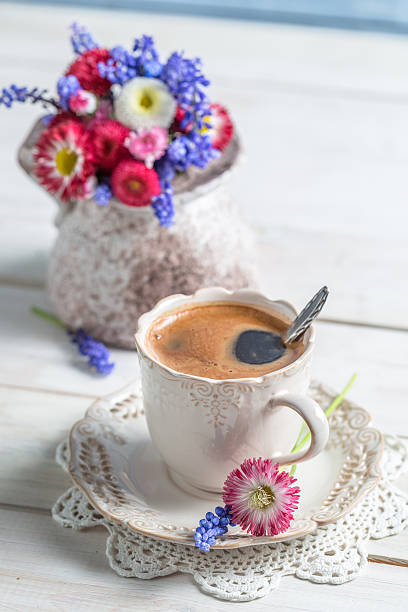 istock Cup of coffee and spring flowers 522261119