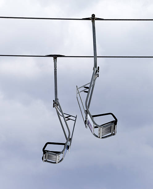 istock Chair-lifts and overcast sky 522262373