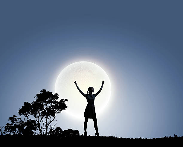 istock Woman and full moon 522275121