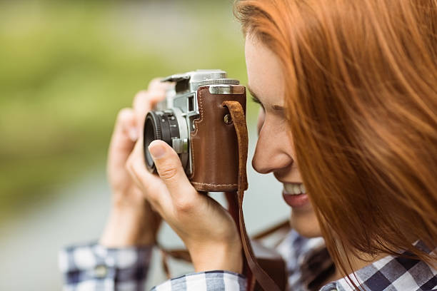 istock Redhead woman taking a photo 522277239