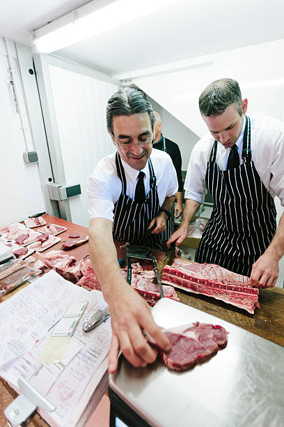istock British Butcher, weighing beef steak 522278293
