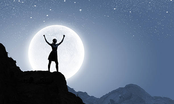 istock Woman and full moon 522278569