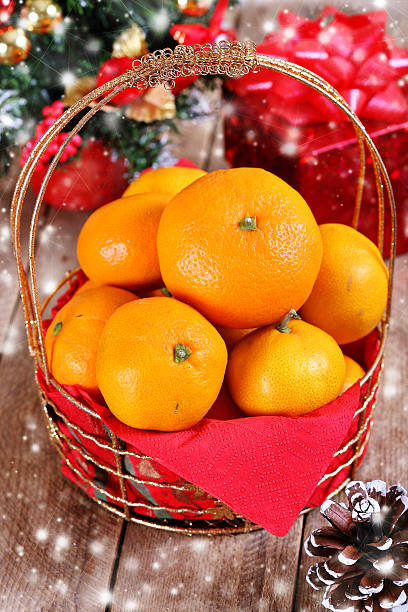 istock Mandarins in a golden basket 522281119