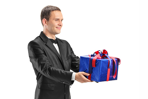 3D businessmen wearing black suits and red ties standing in circle and, gift box - great for topics like surprise, present etc.