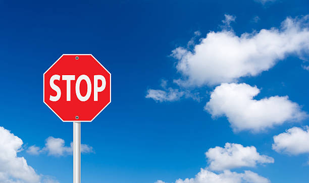 istock roadside red stop sign on a cloudy background. 522294765