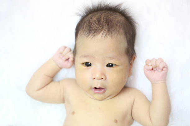istock Asian baby hands raised up 522296507