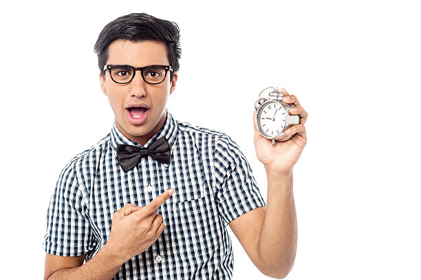 istock Excited man holding an antique clock 522296717