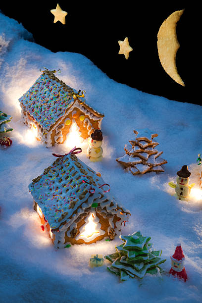 istock Small gingerbread houses in the snow 522298867