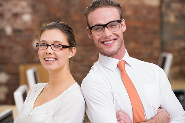istock Two smiling business colleagues in office 522299595