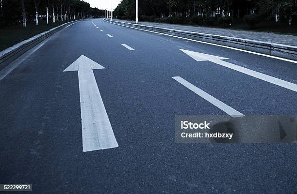 Arrow On The Road Stock Photo - Download Image Now - Arrow Symbol, Asphalt, Close-up