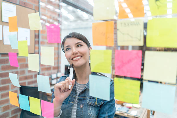 istock Thoughtful woman brainstorming at a creative office 522304046