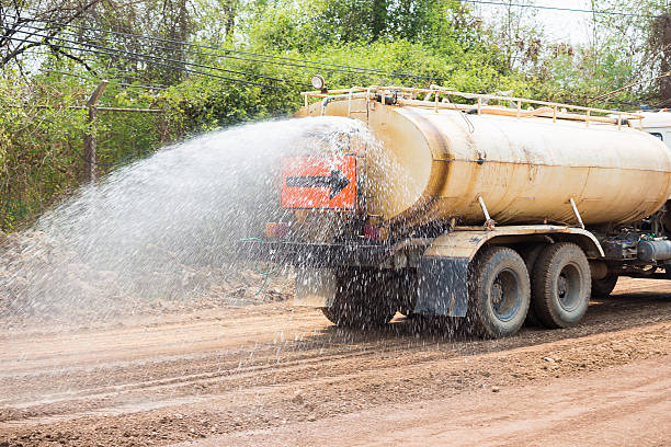 istock Large tank truck working at a construction site 522304190