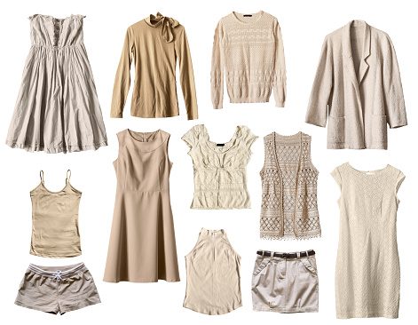 Set of beige female clothes isolated over white