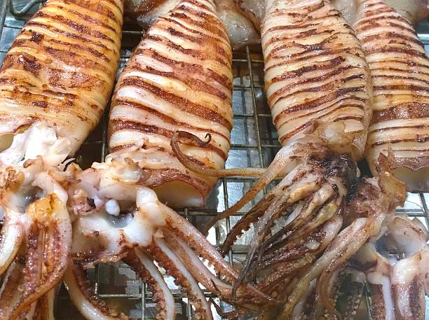 istock The Grilled squid in a market 522307108